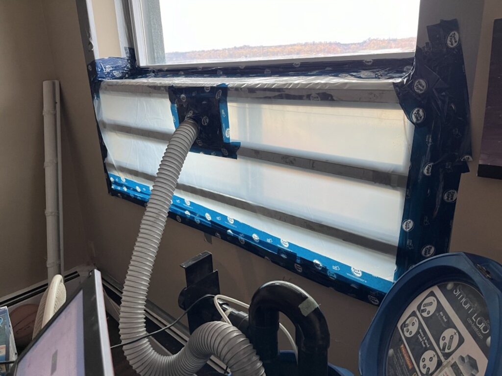 Air and water leakage testing at the operable sashes of a window.